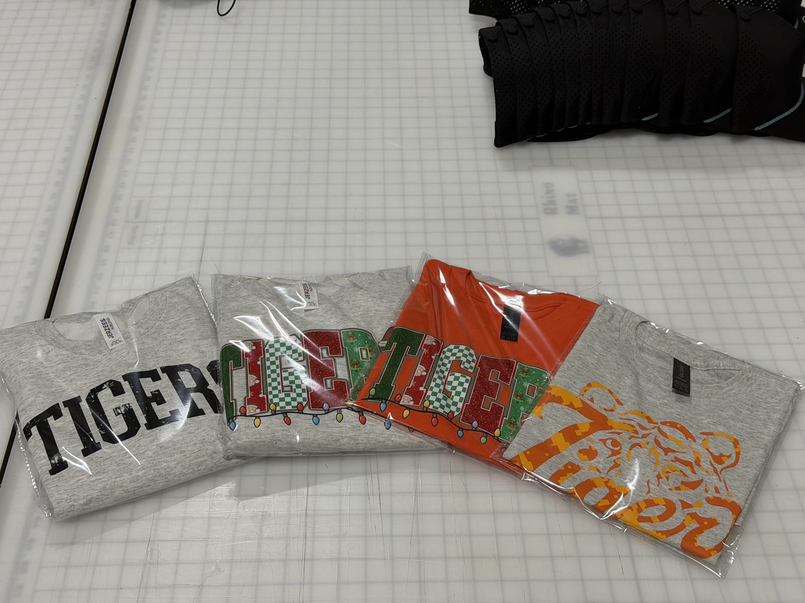 Individually bagged school spirit tees ready to ship