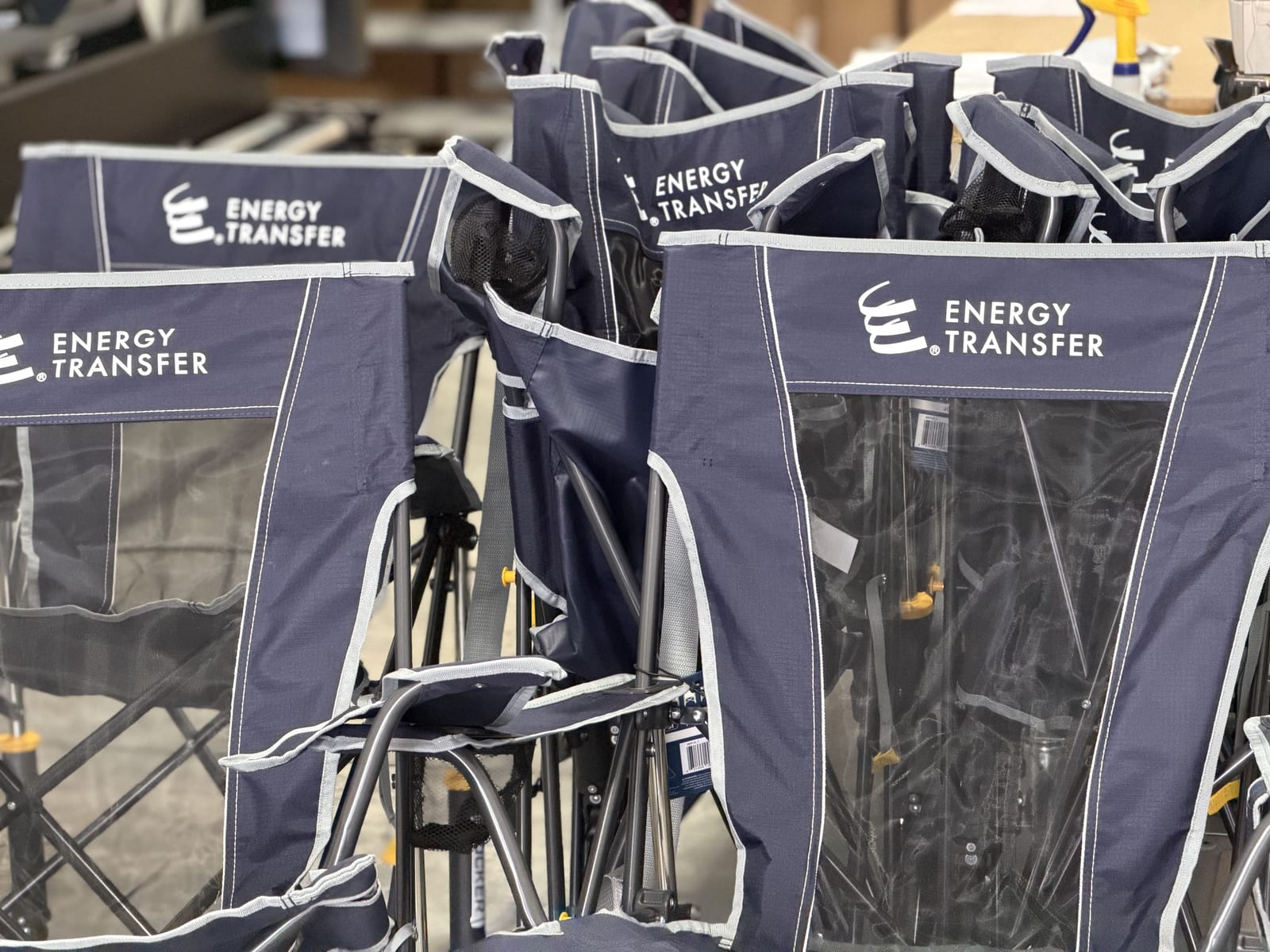 Branded folding camp chairs, stacked for delivery