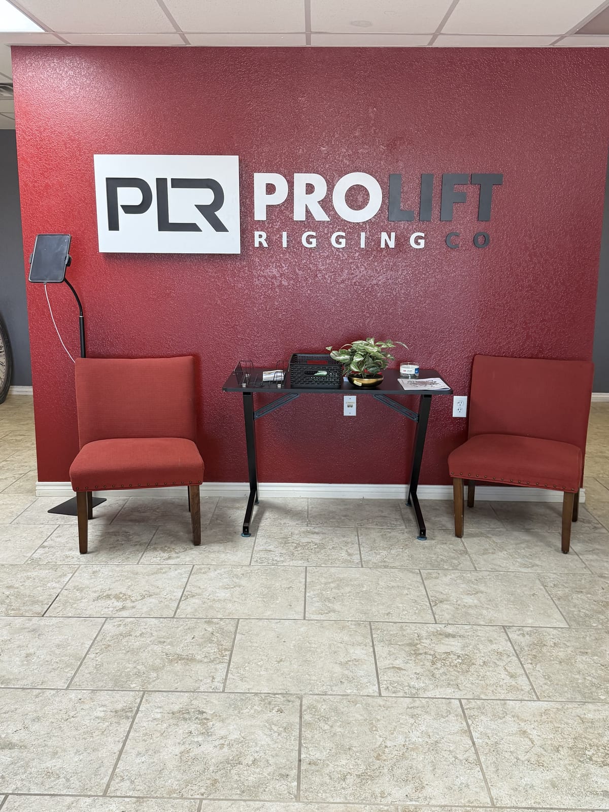 ProLift Rigging dimensional letters on a red lobby wall